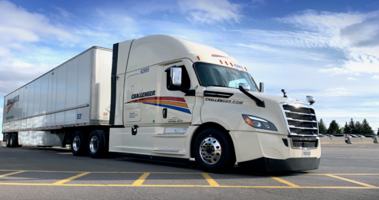 White truck and trailer with Challenger logo